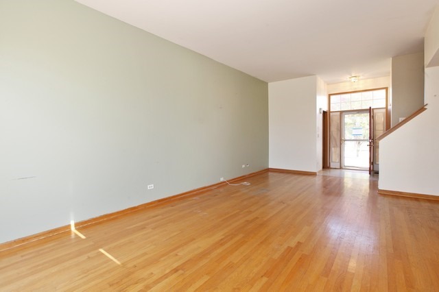 2213 Carpenter Avenue Plainfield, IL 60586 - Photo 5 of 25 a view of empty room with wooden floor and fan