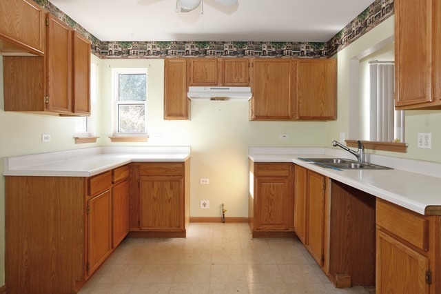 2213 Carpenter Avenue Plainfield, IL 60586 - Photo 8 of 25 a kitchen with a sink cabinets and a window