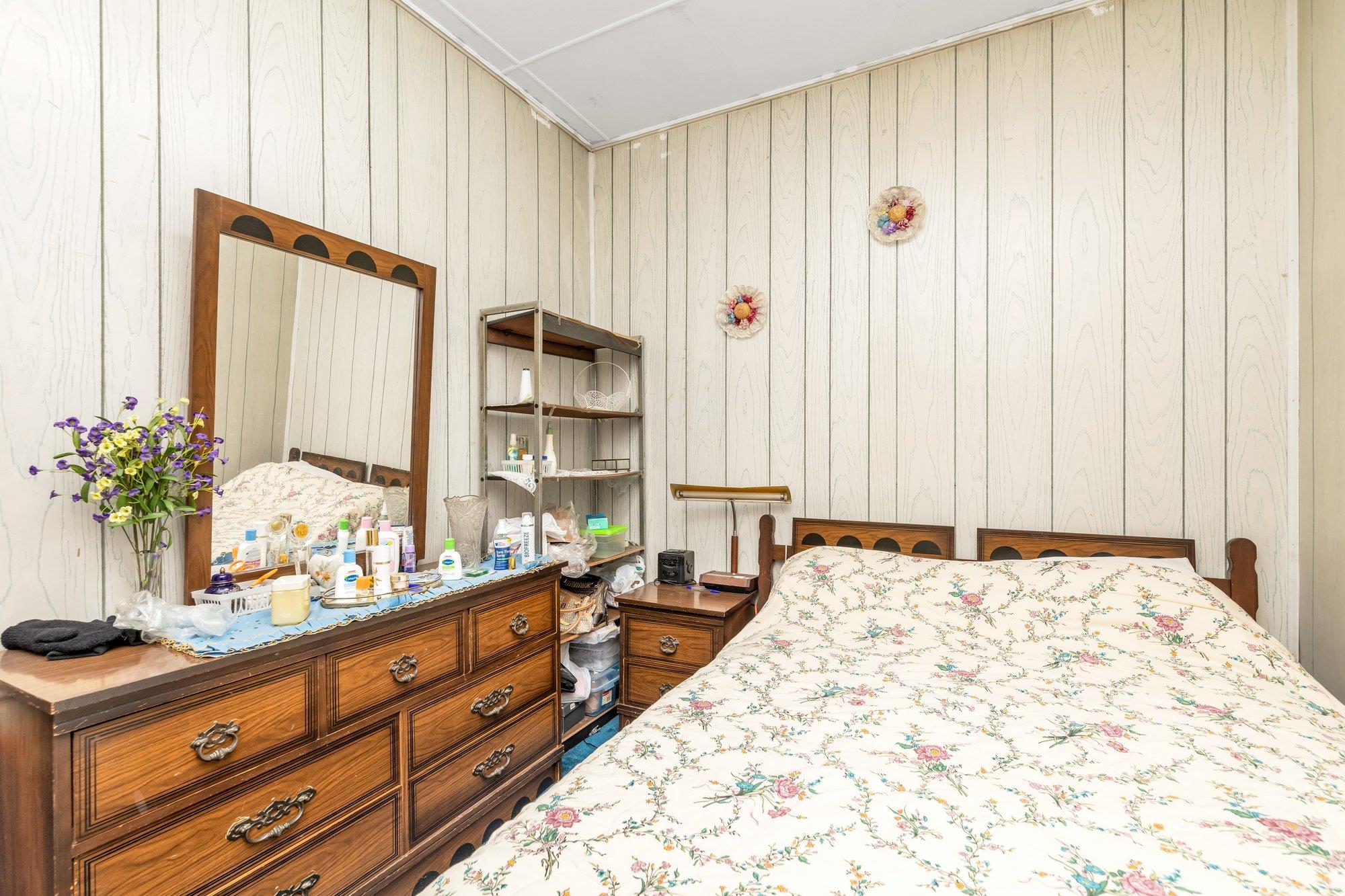 112-50 38th Avenue Queens, NY 11368 - Photo 7 of 17 a large bedroom with bed and window