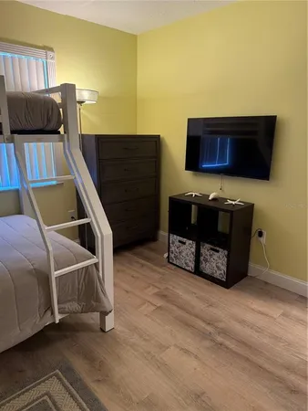 a living room with a couch and a flat screen tv