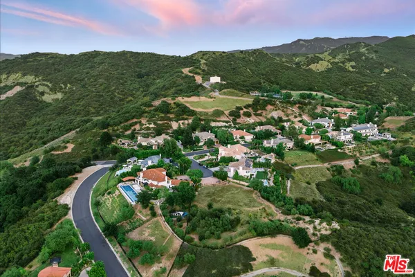 a view of a city with mountains in the background