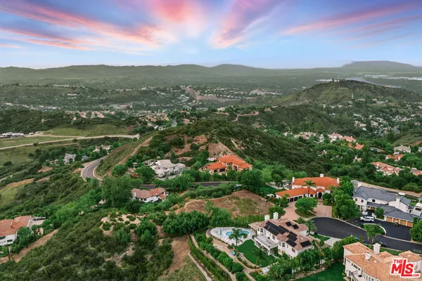 a view of a city with mountains in the background