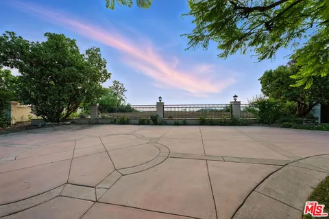 an aerial view of houses covered in trees