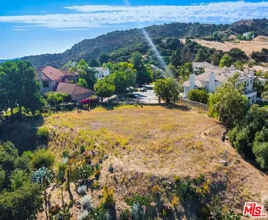 a view of a city with mountains in the background