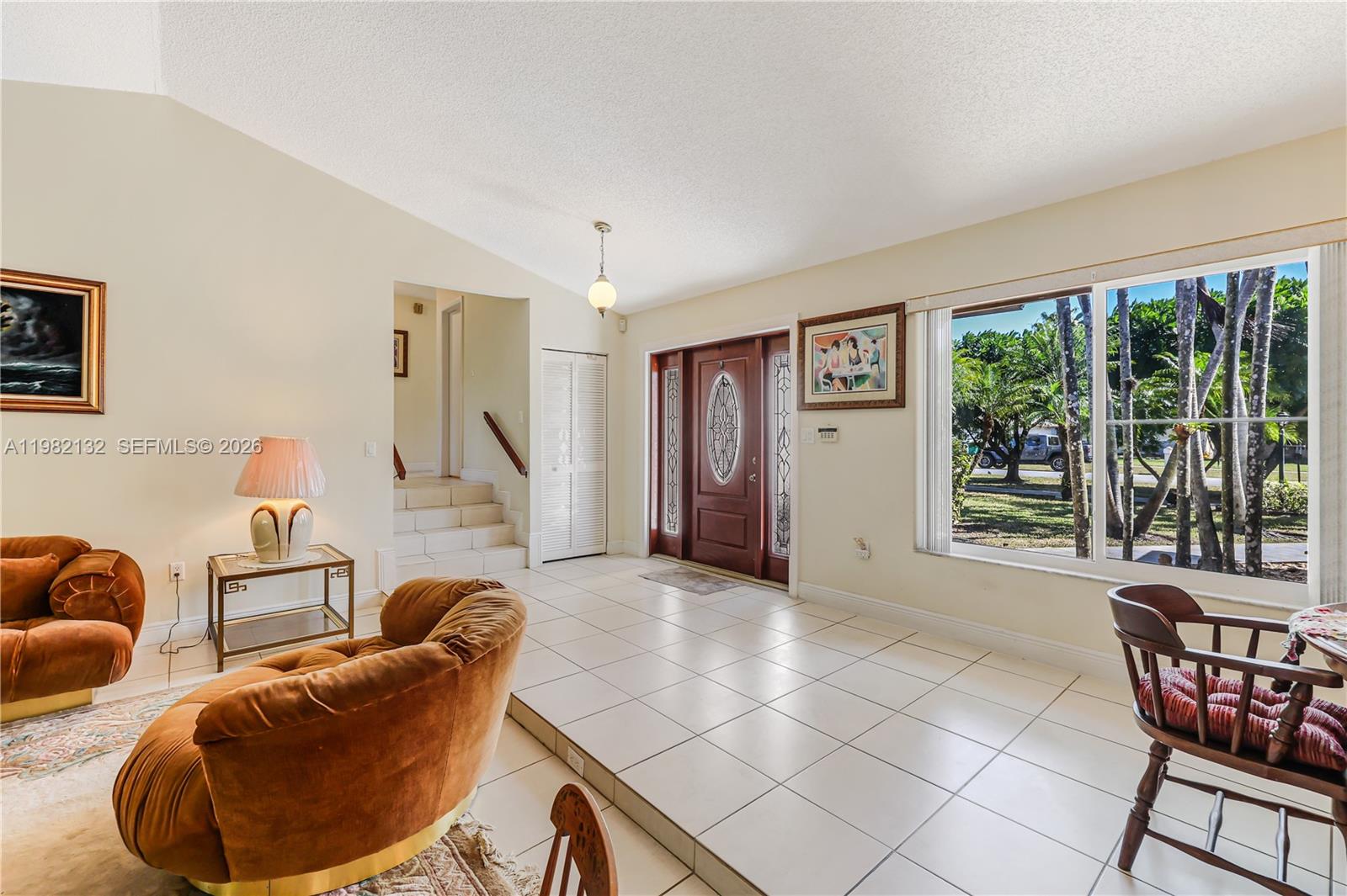 11541 Southwest 100th Street Miami, FL 33176 - Photo 17 of 51 a living room with furniture and a large window