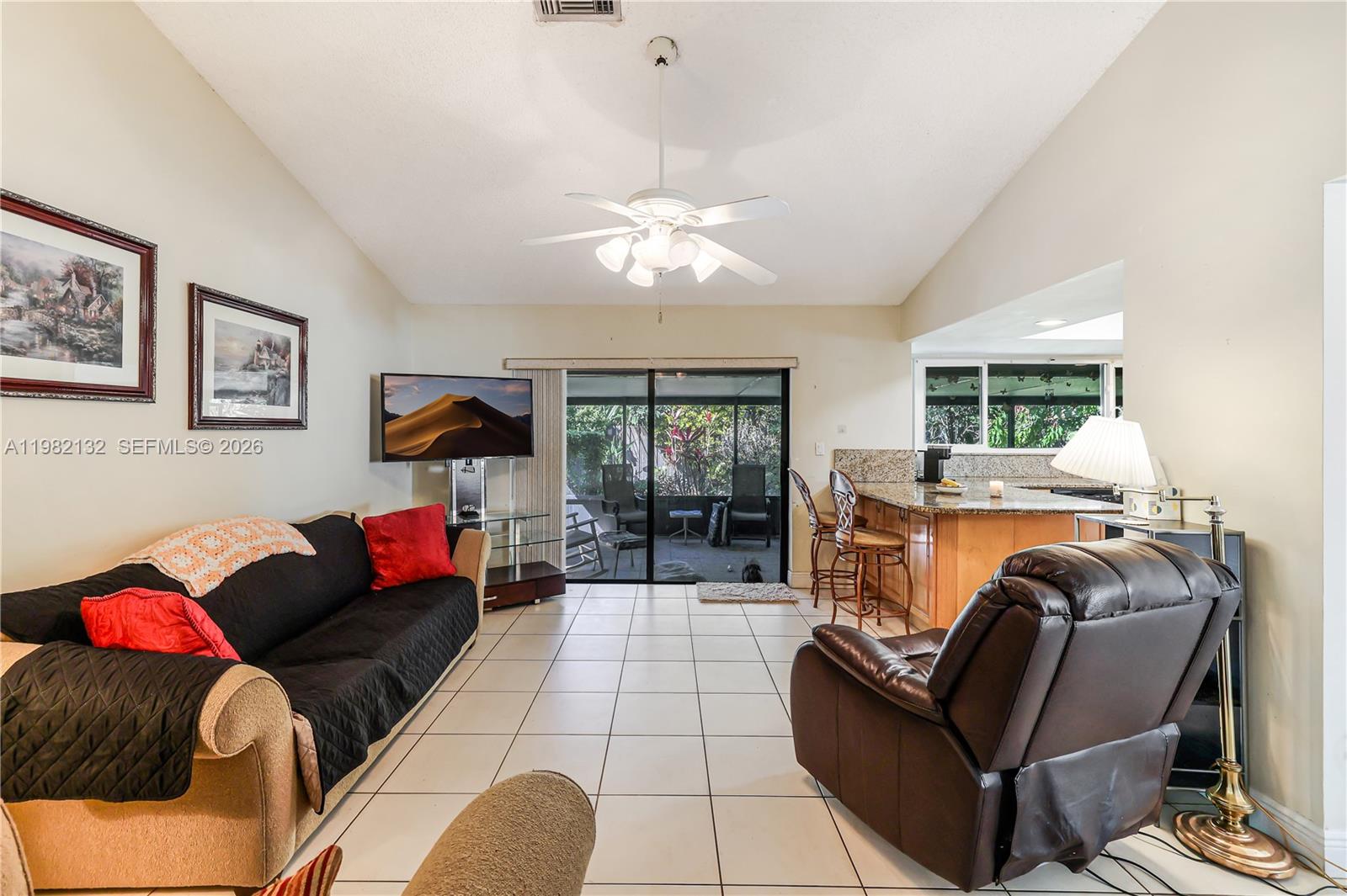 11541 Southwest 100th Street Miami, FL 33176 - Photo 19 of 51 a living room with furniture and a fireplace