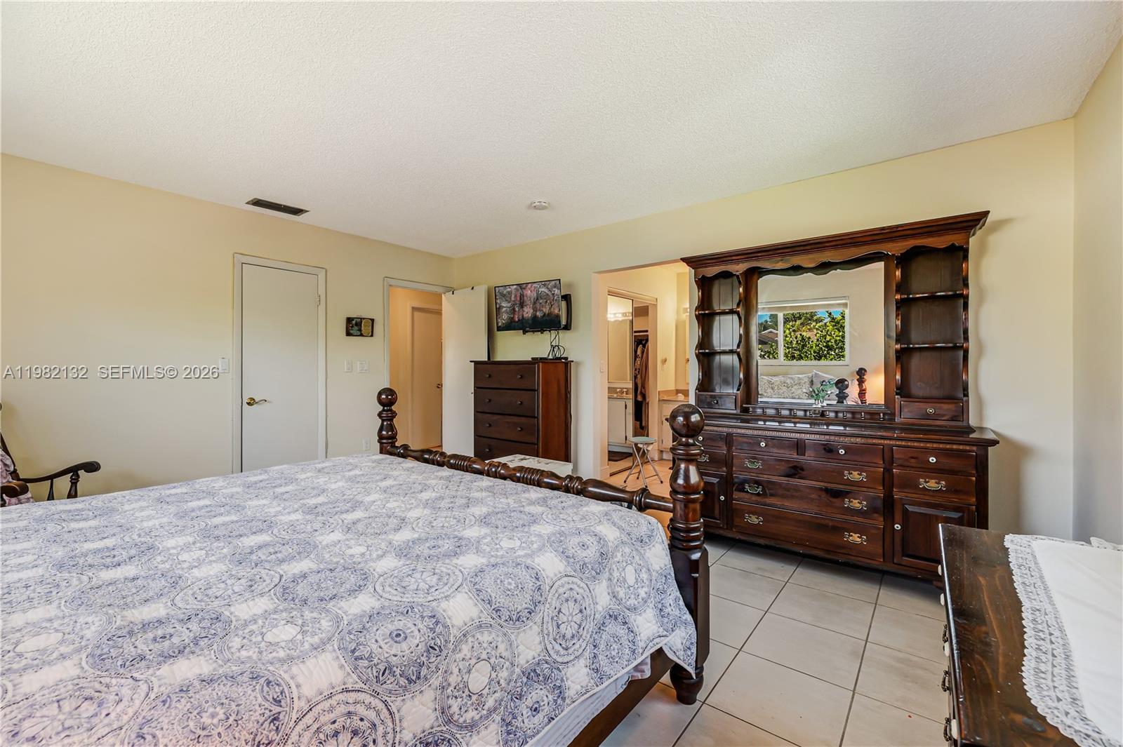 11541 Southwest 100th Street Miami, FL 33176 - Photo 22 of 51 a bedroom with a bed and a dresser