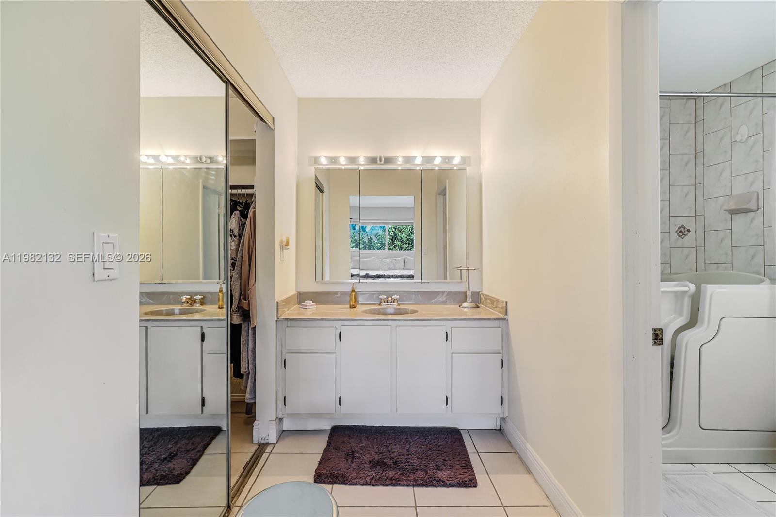 11541 Southwest 100th Street Miami, FL 33176 - Photo 24 of 51 a large bathroom with a granite countertop sink a toilet and shower