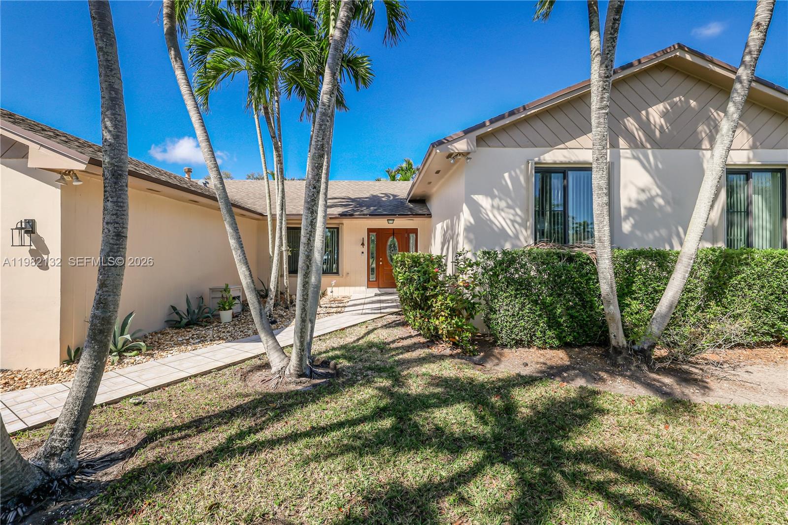11541 Southwest 100th Street Miami, FL 33176 - Photo 3 of 51 a view of a house with a yard