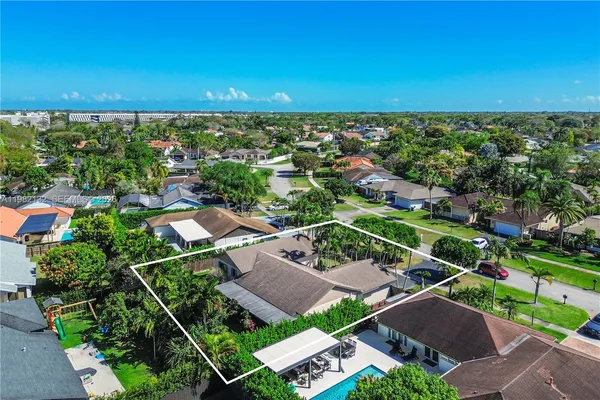 an aerial view of a house with a garden