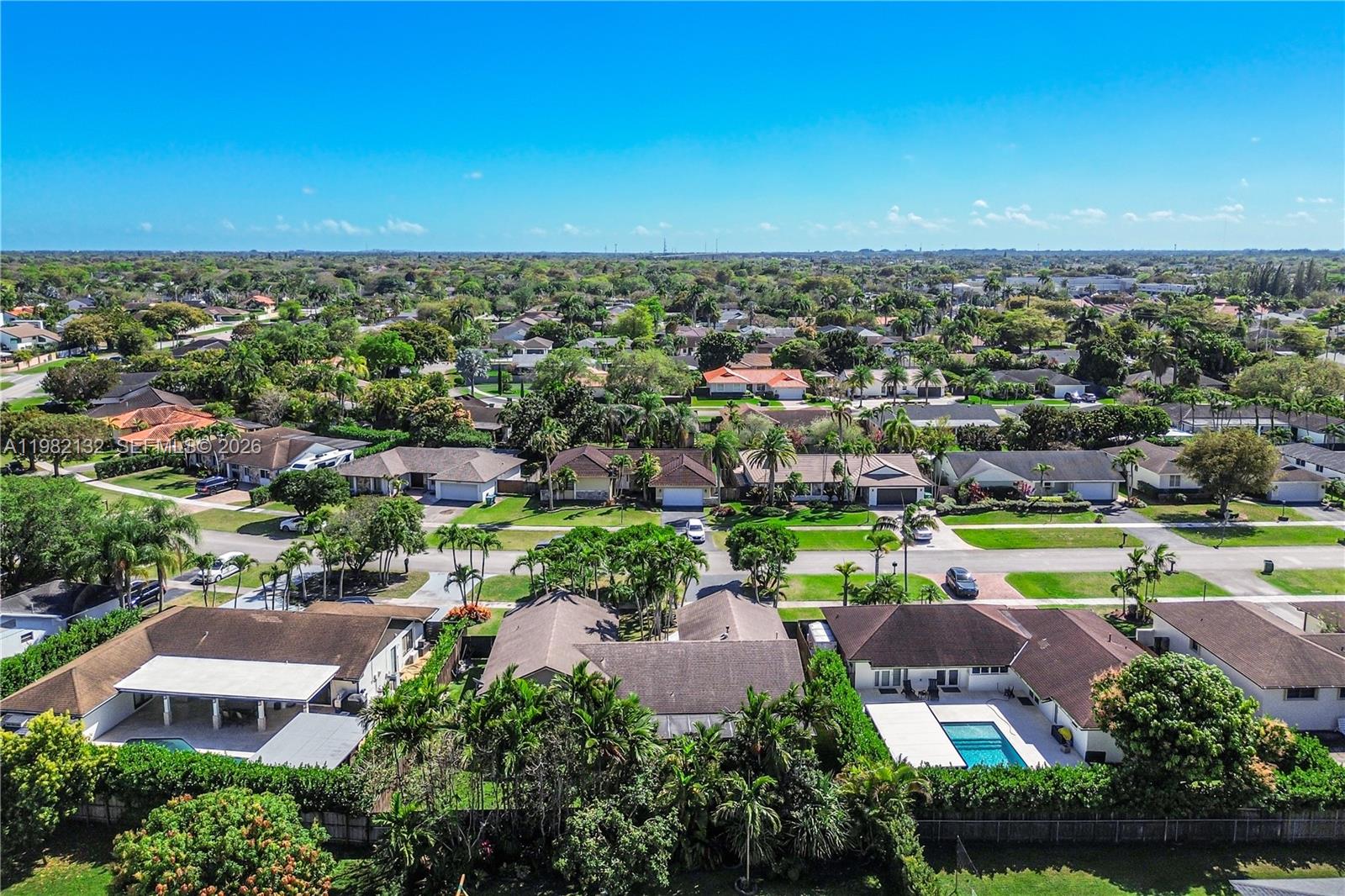 11541 Southwest 100th Street Miami, FL 33176 - Photo 43 of 51 an aerial view of a city with lots of residential buildings ocean and mountain view in back