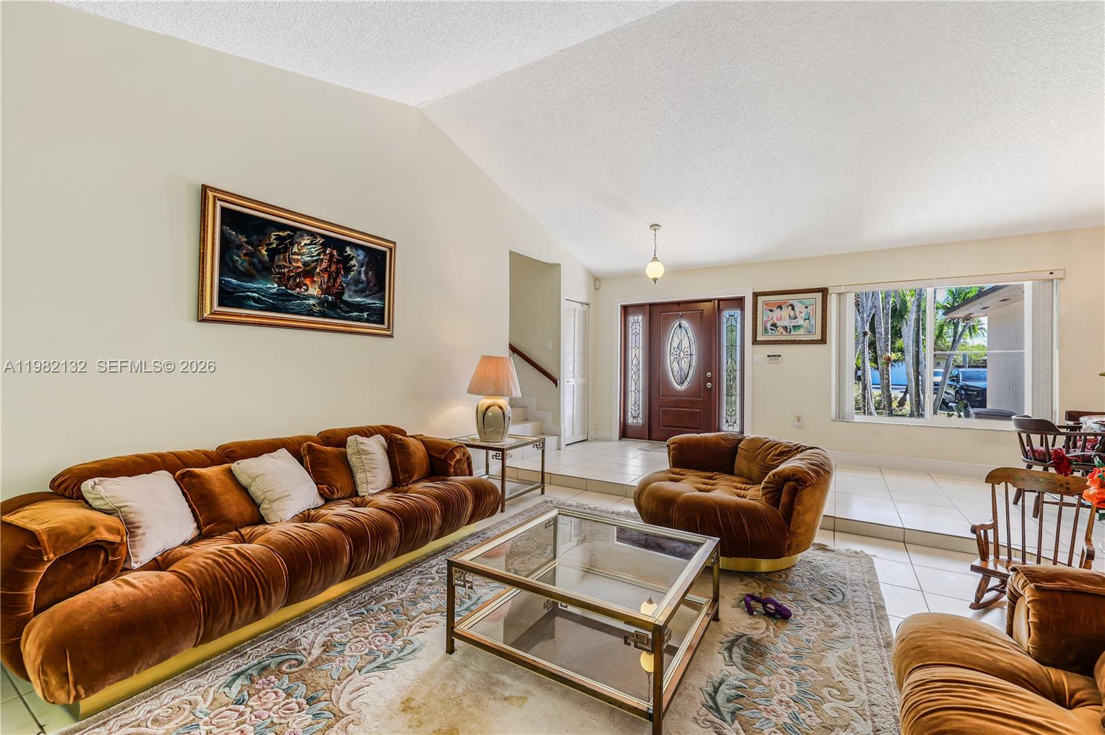 11541 Southwest 100th Street Miami, FL 33176 - Photo 9 of 51 a living room with furniture and a couch
