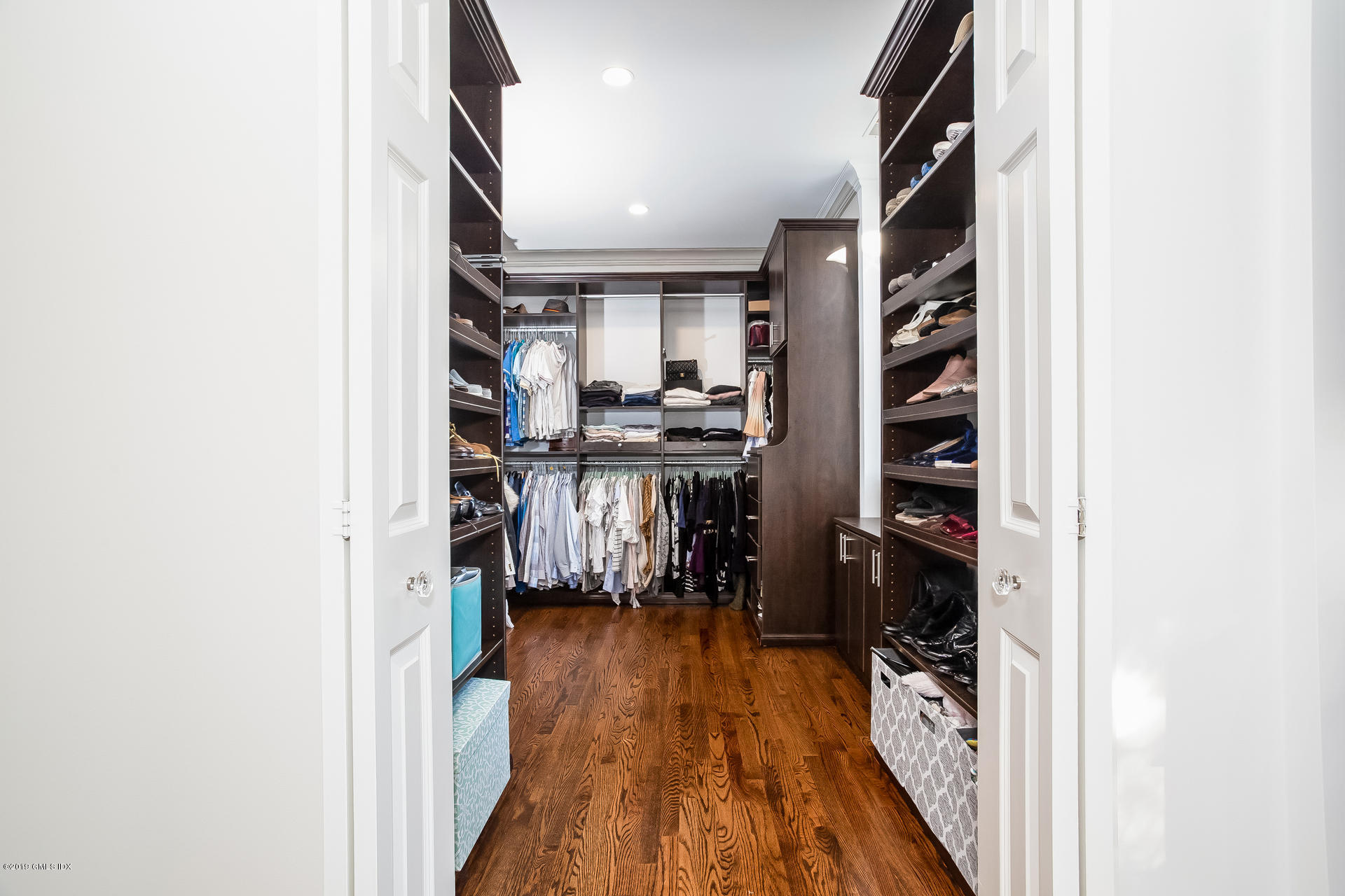 70 Sheep Hill Road Riverside, CT 06878 - Photo 25 of 43 a view of a hallway with wooden floor and cabinets