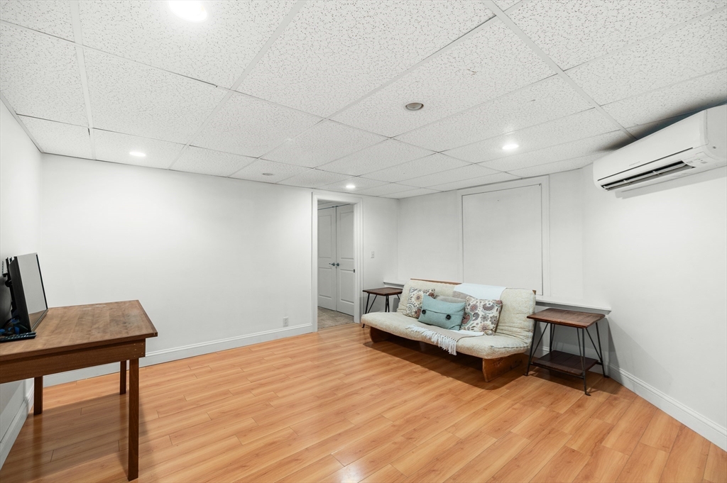 32 Witham Street, Unit B Gloucester, MA 01930 - Photo 26 of 36 a living room with furniture and a wooden floor