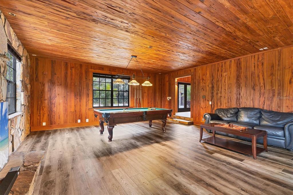 2308 Shadow Oaks Road Sarasota, FL 34240 - Photo 12 of 84 a living room with furniture a wooden floor and a window
