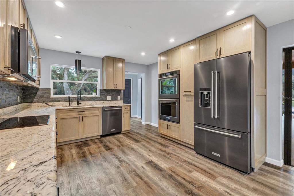 2308 Shadow Oaks Road Sarasota, FL 34240 - Photo 18 of 84 a kitchen with a sink stainless steel appliances and counter space