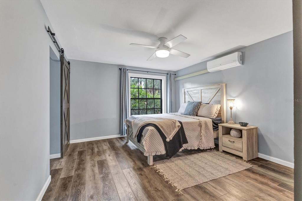 2308 Shadow Oaks Road Sarasota, FL 34240 - Photo 26 of 84 a bedroom with a bed and window