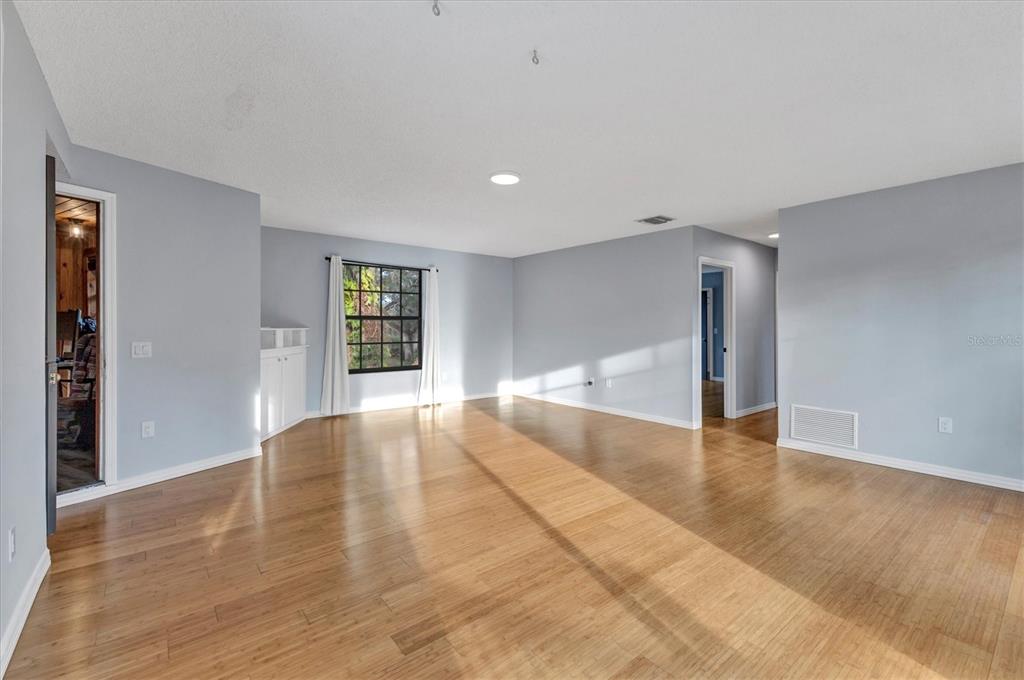 2308 Shadow Oaks Road Sarasota, FL 34240 - Photo 41 of 84 a view of an empty room with window and wooden floor