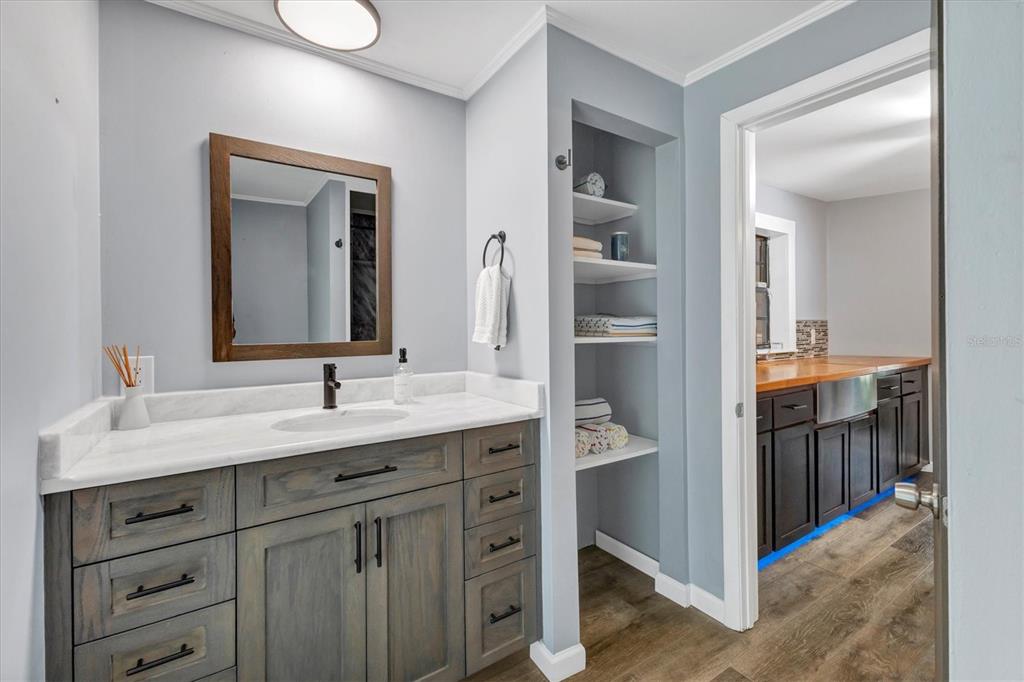 2308 Shadow Oaks Road Sarasota, FL 34240 - Photo 42 of 84 a en suite bathroom with a double vanity sink and a mirror