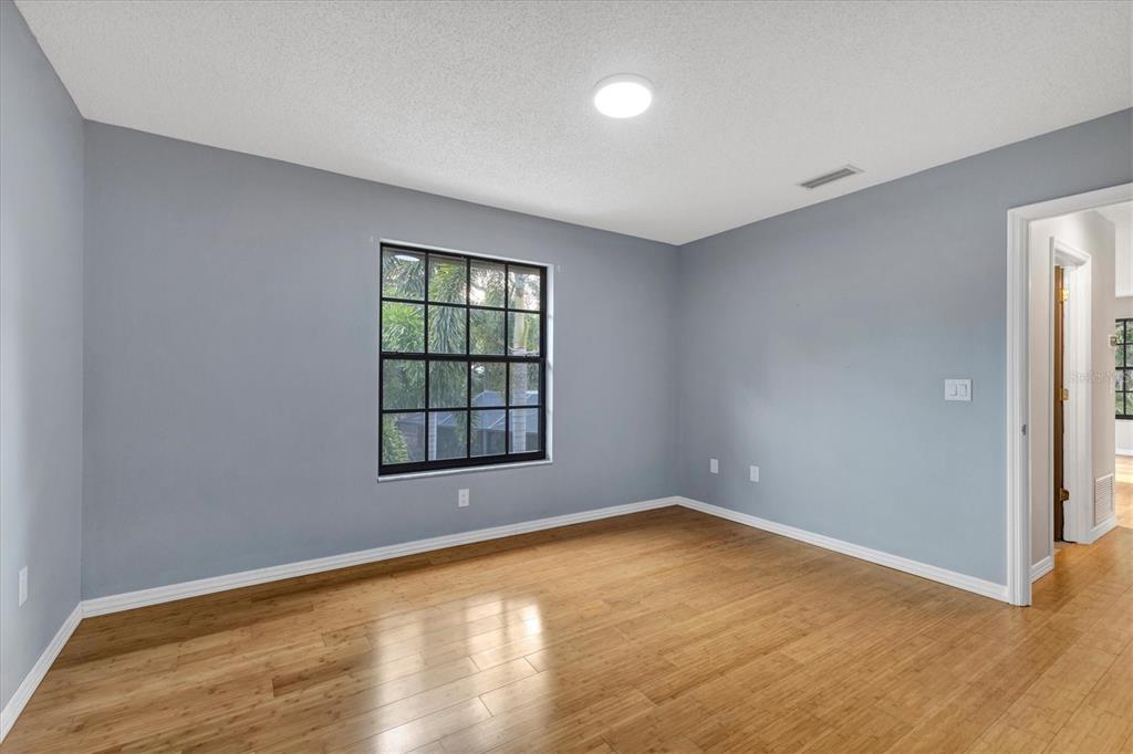 2308 Shadow Oaks Road Sarasota, FL 34240 - Photo 45 of 84 wooden floor in an empty room with a window