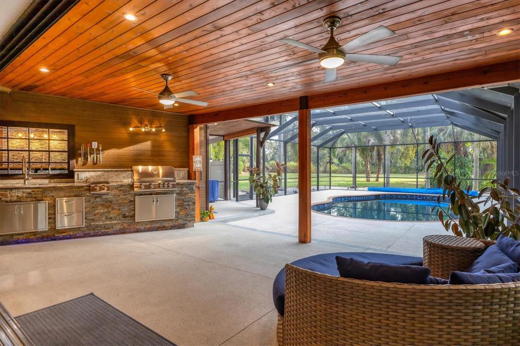 2308 Shadow Oaks Road Sarasota, FL 34240 - Photo 54 of 84 a living room with furniture and a potted plant