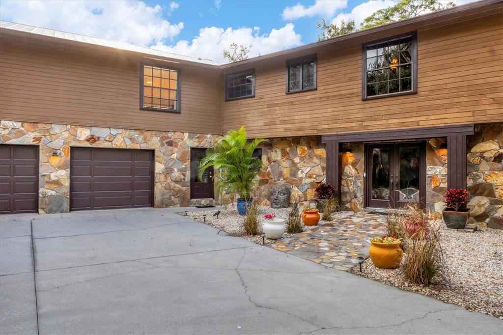2308 Shadow Oaks Road Sarasota, FL 34240 - Photo 6 of 84 a view of a house with patio outdoor seating area