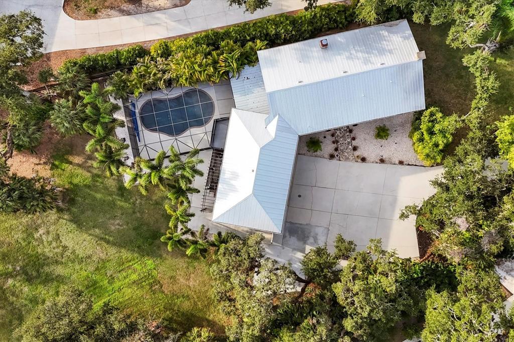 2308 Shadow Oaks Road Sarasota, FL 34240 - Photo 61 of 84 an aerial view of a house with a yard and garden