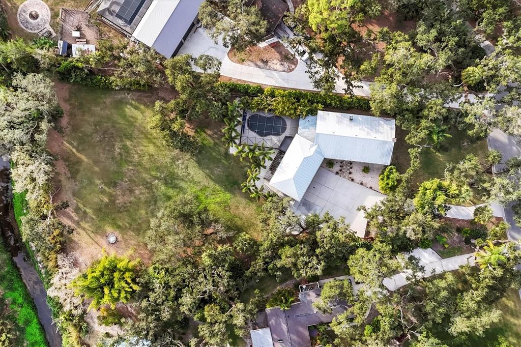 2308 Shadow Oaks Road Sarasota, FL 34240 - Photo 62 of 84 an aerial view of a house with a yard