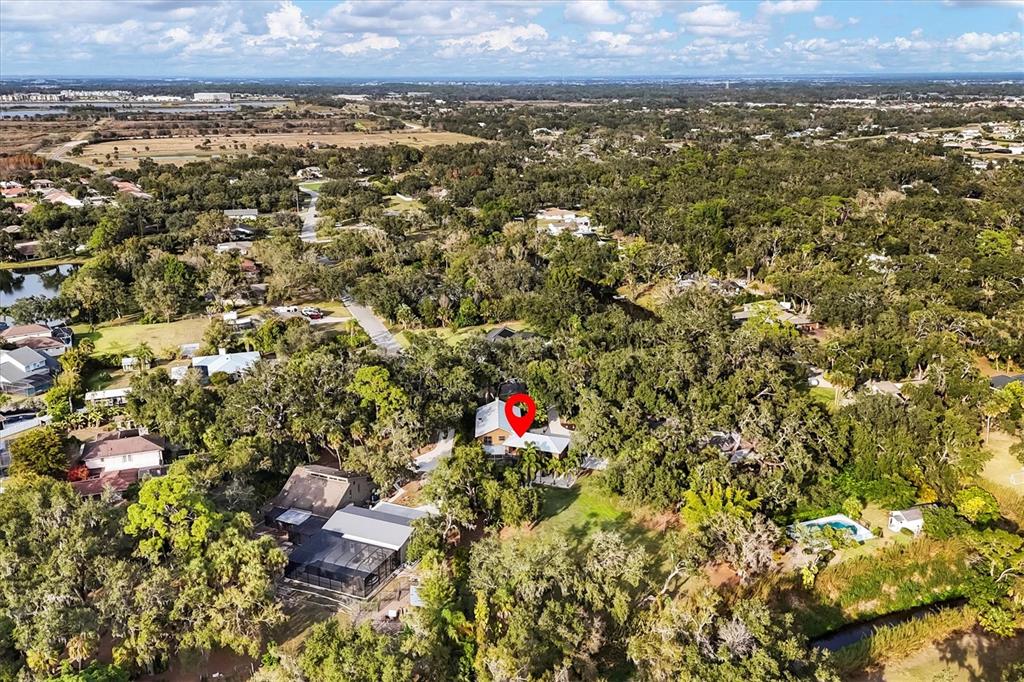 2308 Shadow Oaks Road Sarasota, FL 34240 - Photo 64 of 84 an aerial view of residential houses with outdoor space and trees