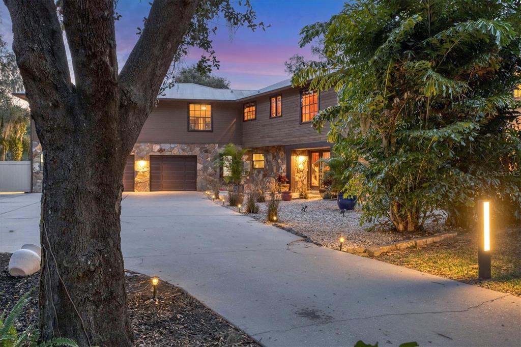 2308 Shadow Oaks Road Sarasota, FL 34240 - Photo 69 of 84 a front view of a house with a yard
