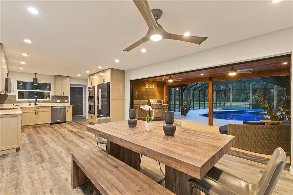 2308 Shadow Oaks Road Sarasota, FL 34240 - Photo 72 of 84 a view of a kitchen with kitchen island and stainless steel appliances