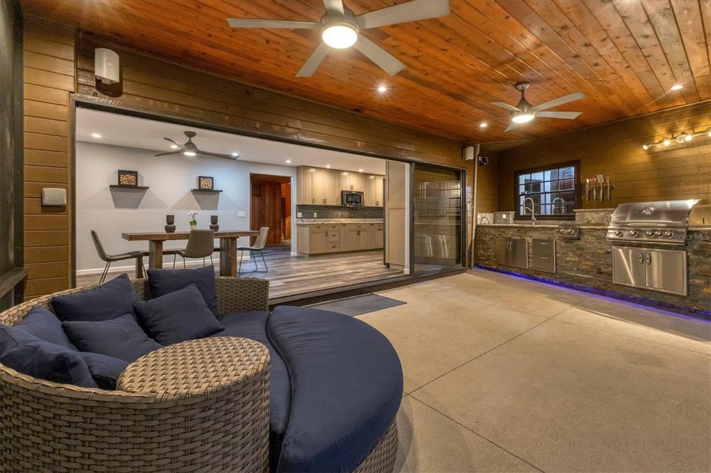 2308 Shadow Oaks Road Sarasota, FL 34240 - Photo 73 of 84 a living room with furniture and a flat screen tv