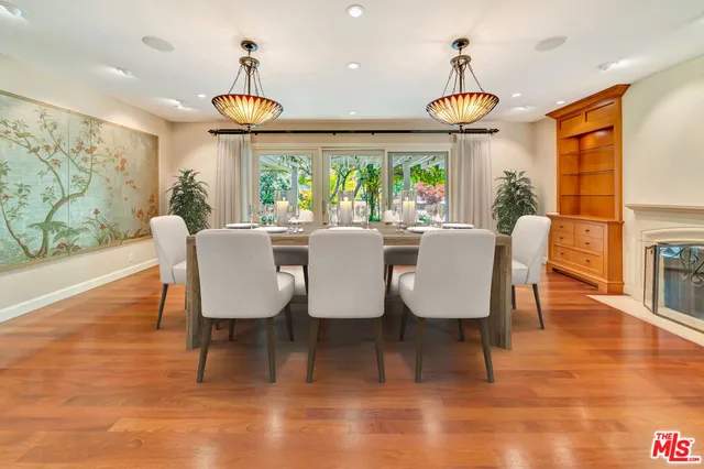 a living room with fireplace furniture and a flat screen tv