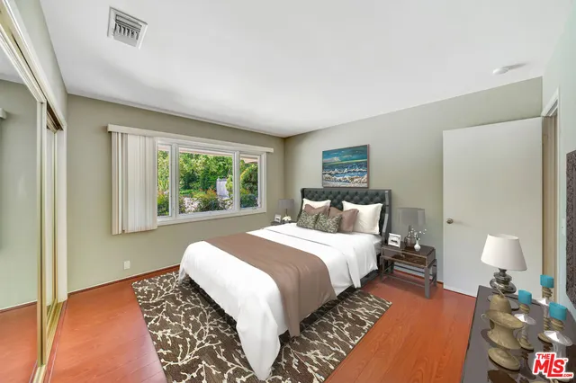 a spacious bathroom with a double vanity sink and mirror