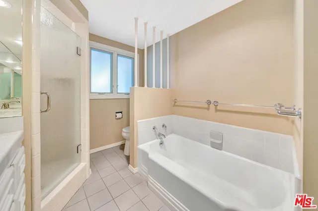 a bathroom with a toilet sink and a shower