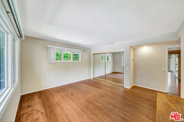 a backyard of a house with a garden and plants