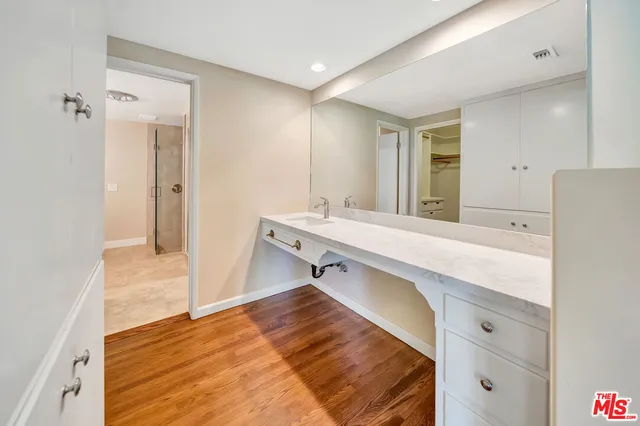 a bedroom with a bed and a view of bathroom