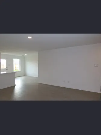 a kitchen with a sink and a refrigerator