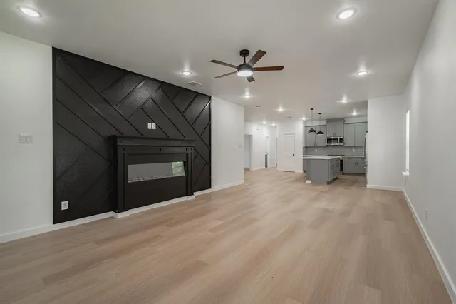 a view of a kitchen with a sink and a stove top oven