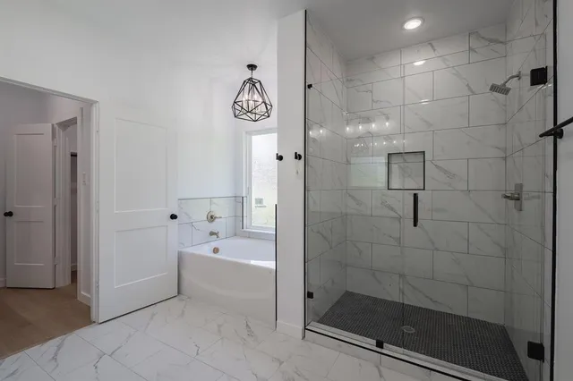 a spacious bathroom with a double vanity sink mirror double and bathtub