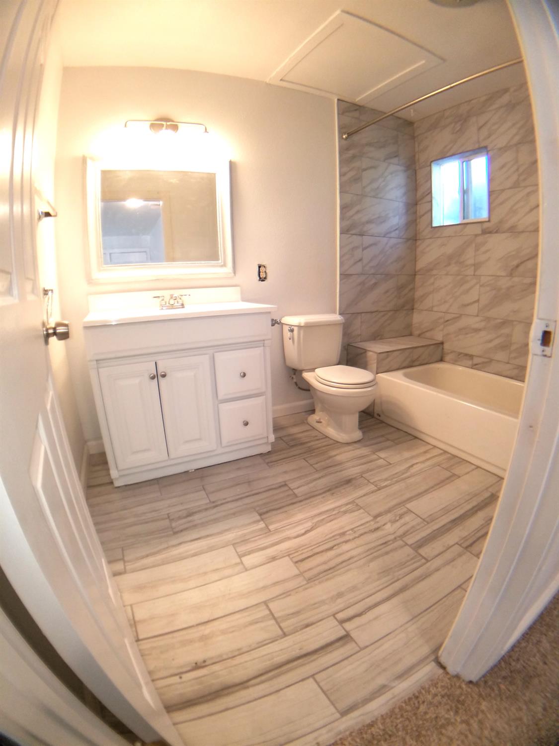 5121 Kenneth Avenue Carmichael, CA 95608 - Photo 15 of 38 a bathroom with a sink a toilet and a mirror