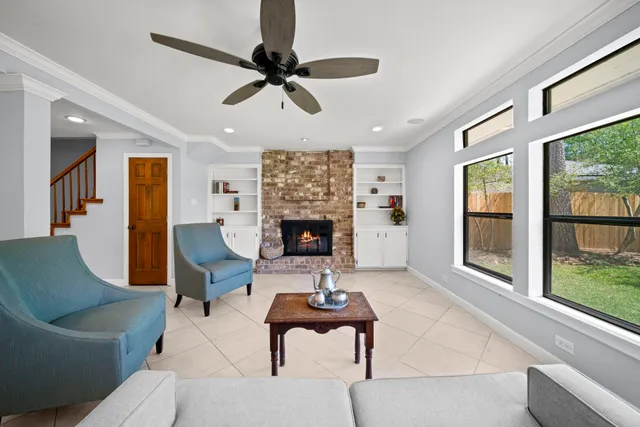 a living room with furniture and a fireplace