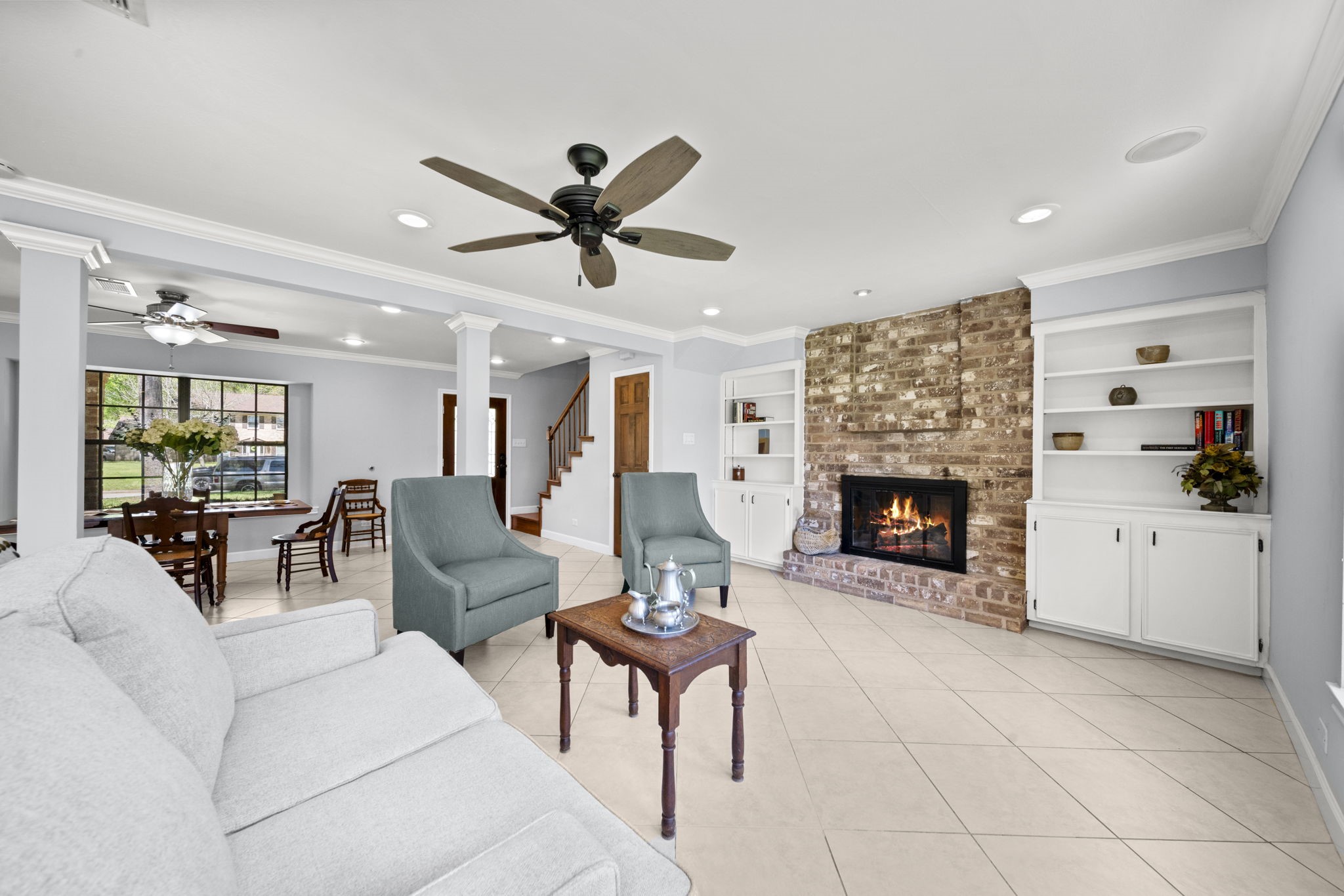 6315 Allentown Drive Spring, TX 77389 - Photo 15 of 46 a living room with furniture a fireplace and a ceiling fan