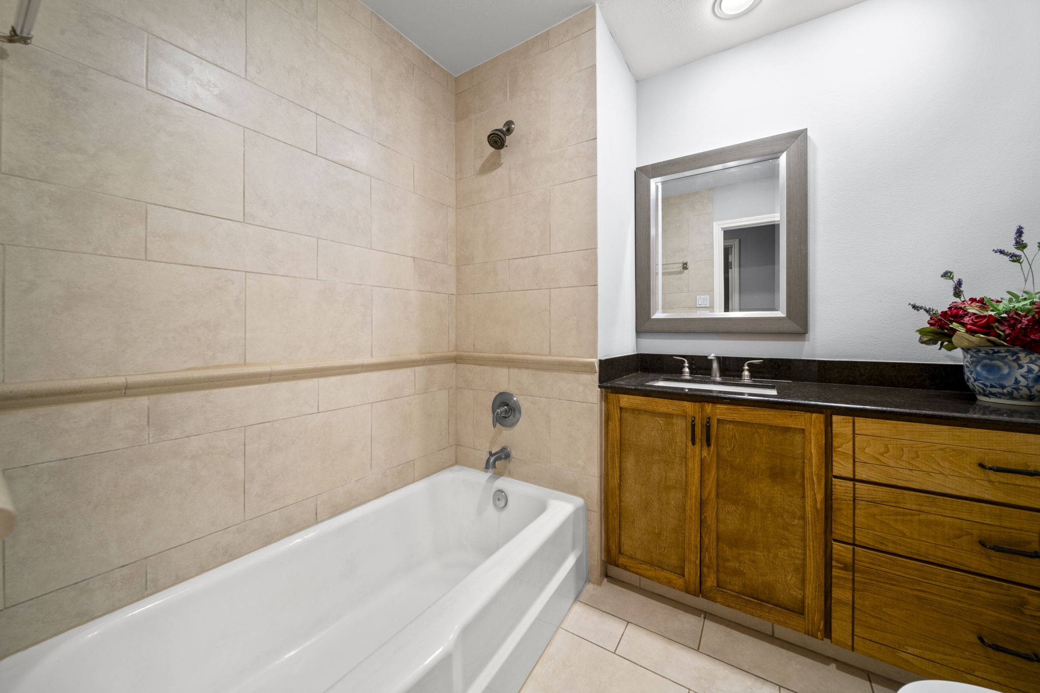 6315 Allentown Drive Spring, TX 77389 - Photo 26 of 46 a bathroom with a tub sink and mirror