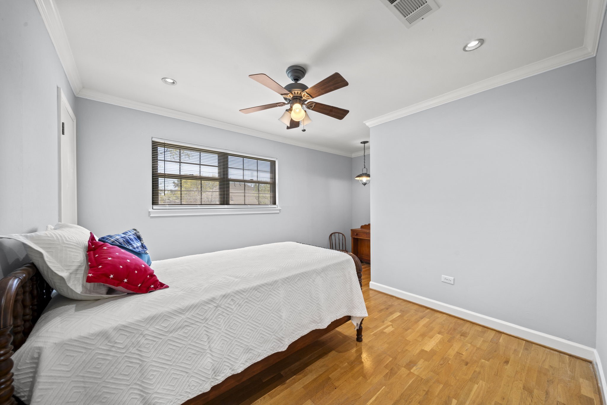6315 Allentown Drive Spring, TX 77389 - Photo 29 of 46 a bedroom with a bed and a chandelier fan