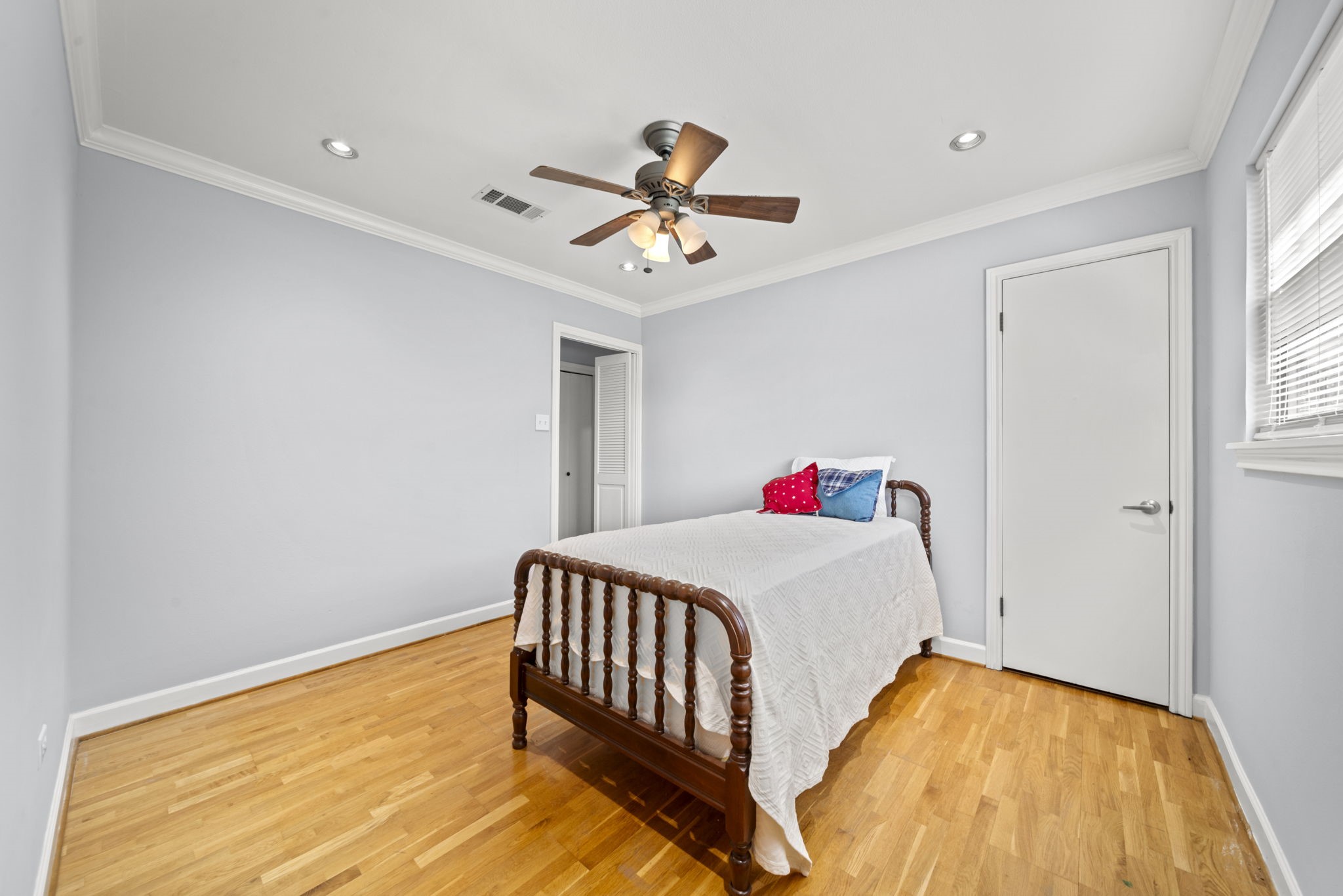 6315 Allentown Drive Spring, TX 77389 - Photo 30 of 46 a bedroom with a bed and a chandelier