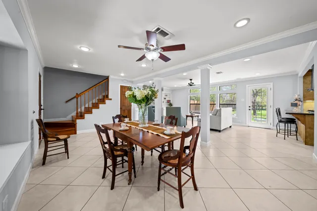 a dining room with furniture and window