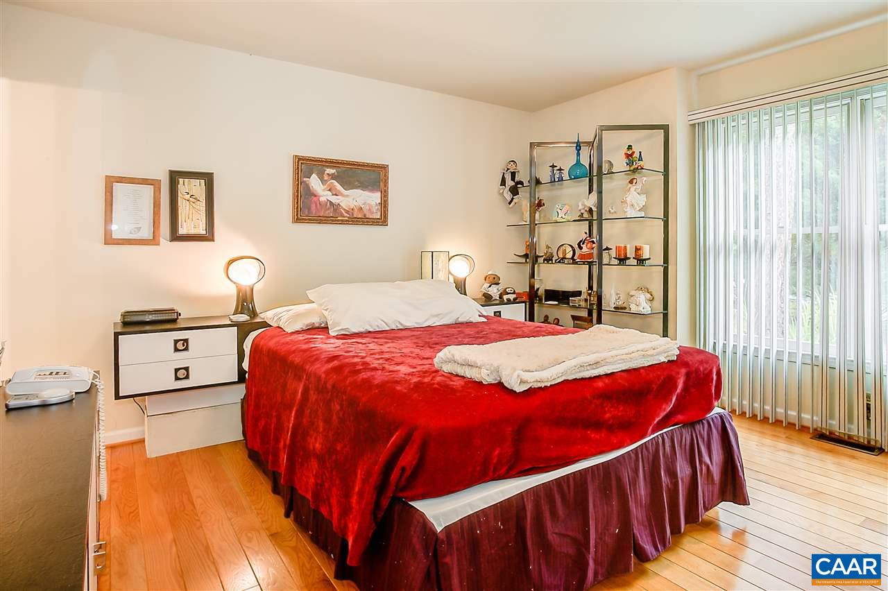 151 Goldenrod Road Ruckersville, VA 22968 - Photo 21 of 33 a bedroom with a bed and a night stand