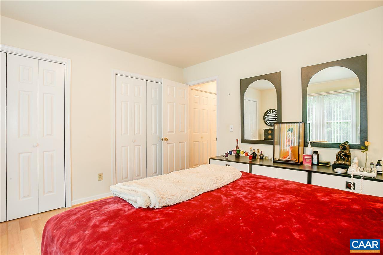 151 Goldenrod Road Ruckersville, VA 22968 - Photo 22 of 33 a bedroom with a bed and a table