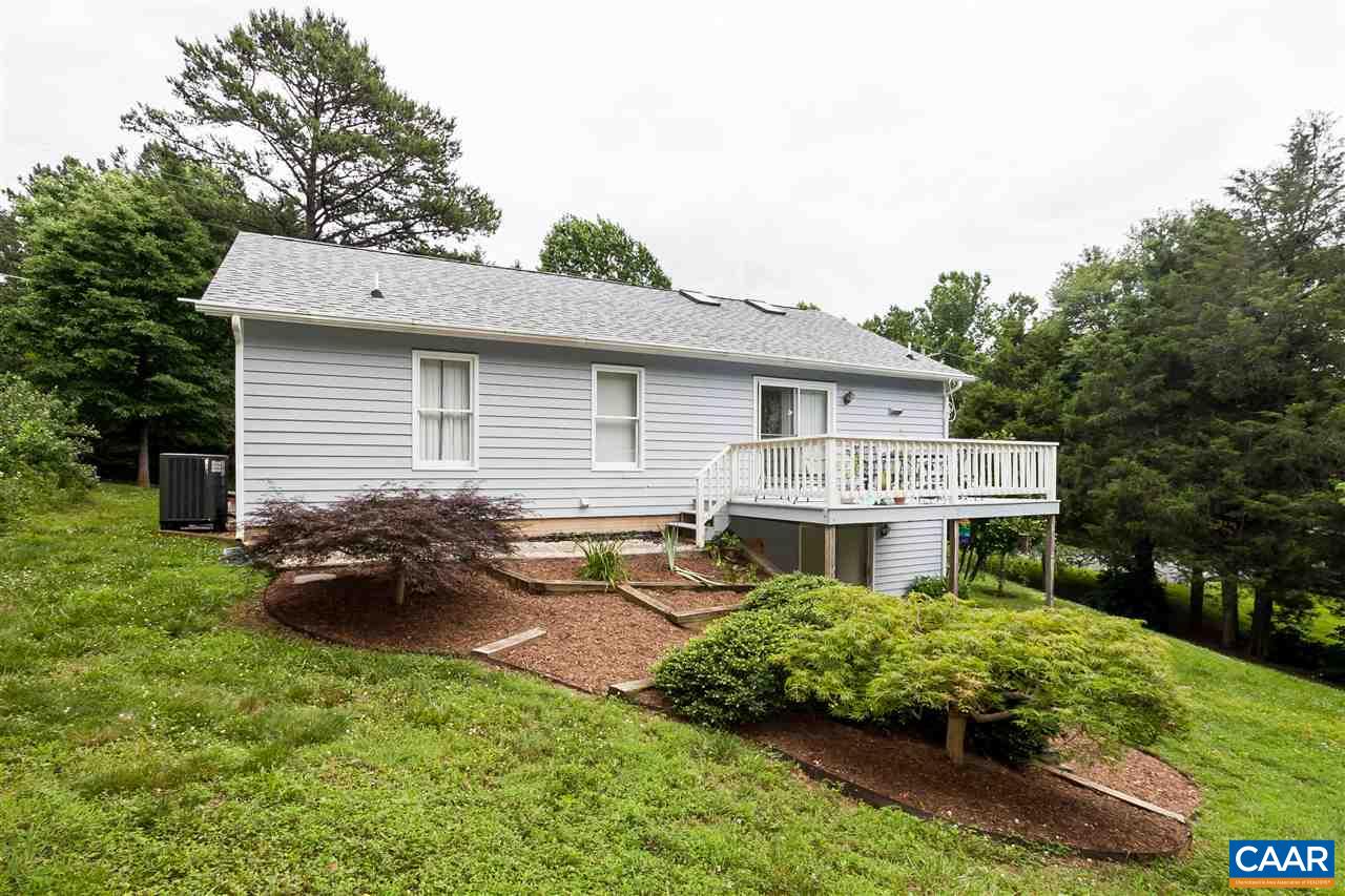 151 Goldenrod Road Ruckersville, VA 22968 - Photo 5 of 33 a front view of a house with a garden